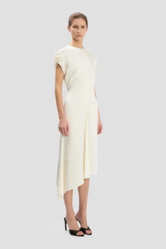 Twist-jurk met schouderdetails in ivoor