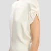 Twist-jurk met schouderdetails in ivoor