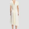 Twist-jurk met schouderdetails in ivoor